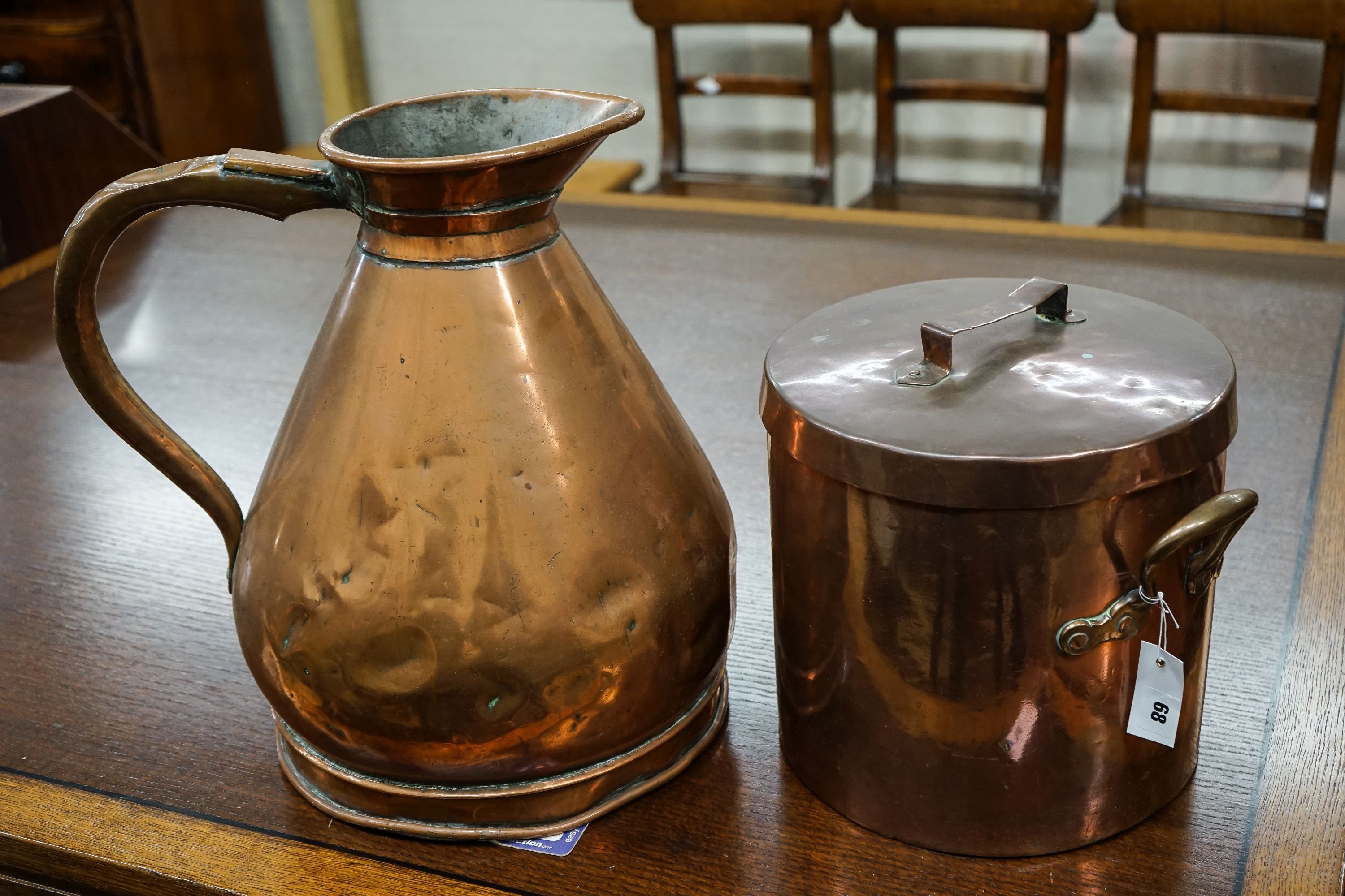 A Victorian copper jug measure, together with a Victorian copper harvest flagon, larger 48cm high